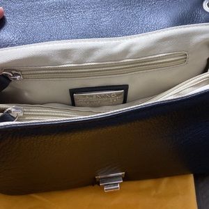 Valentino black color with shoulder cross handbags made in Italy